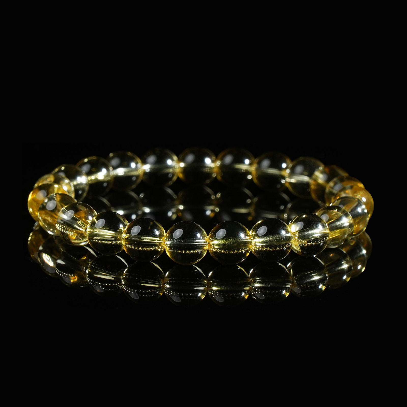 A round-bead citrine gemstone bracelet, showcasing its golden clarity and shine, perfect for energy and abundance
