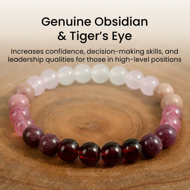 Bracelet styled on wooden surface with overlay text, featuring garnet and quartz beads, designed to support self-love, leadership, and emotional grounding.