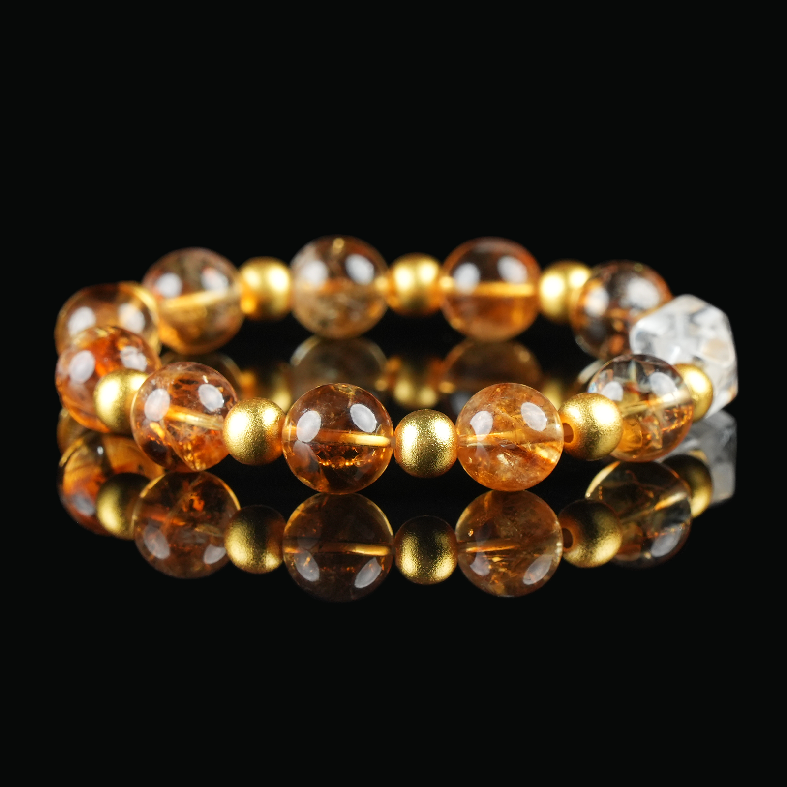 Angled view of citrine bracelet showing polished golden-yellow beads, symbolizing prosperity, confidence, and abundance.