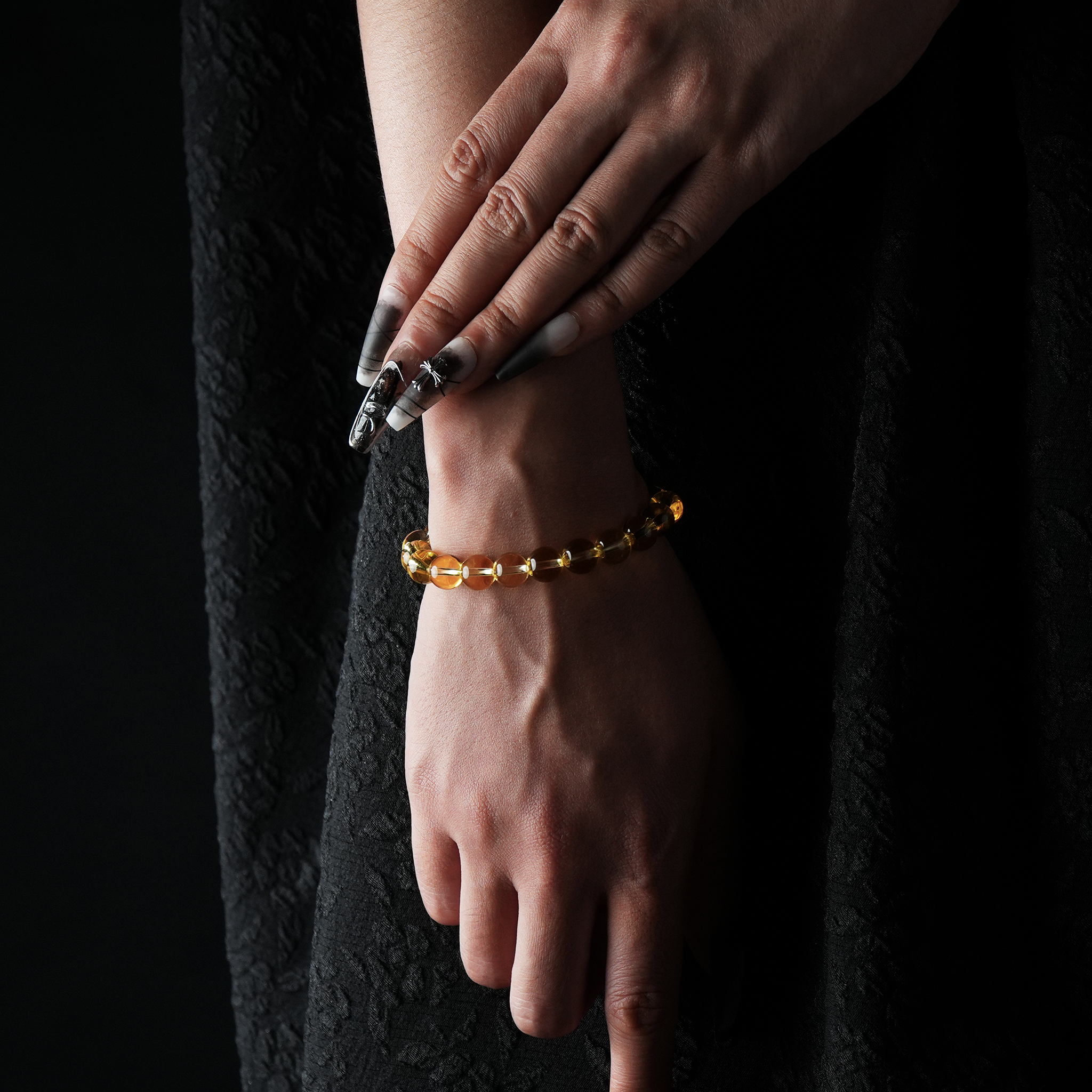 A golden yellow Natural Citrine beaded bracelet worn elegantly on the wrist.