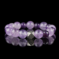 Amethyst Crystal Healing Bracelet with Silver Geometric Charm – Calming Spiritual Energy Stone Jewelry on Black Background.