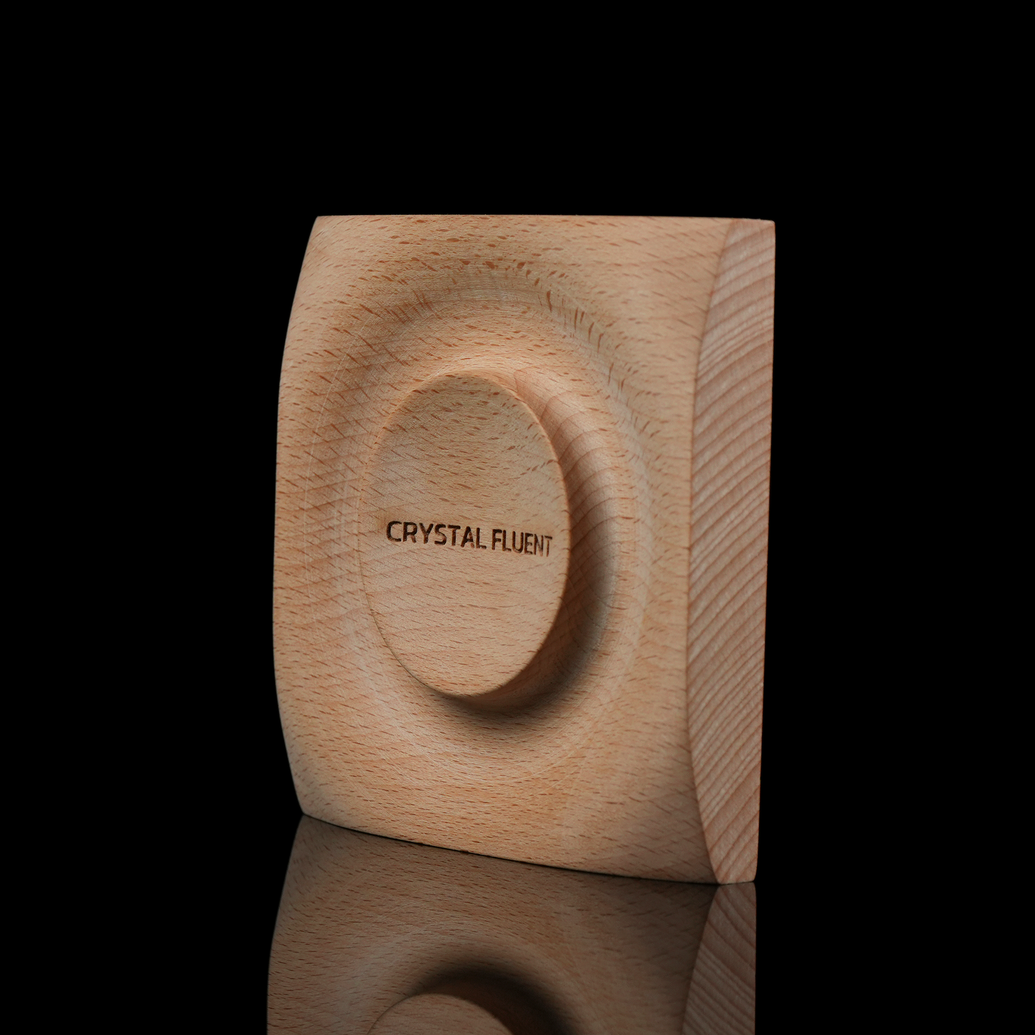 A side-angled shot highlighting the depth of the central cavity and the overall geometric shape of the tray. The engraving is clearly visible from this perspective.