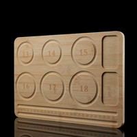 An angled perspective of the beading tray showing its natural bamboo texture and precision-cut grooves. The circular guides and measurement scale are clearly visible for practical use in jewelry making.