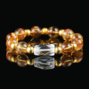 Citrine crystal bracelet with transparent golden beads and gold accents, designed to attract wealth, joy, and positive energy.