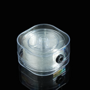 This image shows a spool of transparent elastic thread neatly stored inside a compact, rounded plastic dispenser. The crystal-clear thread is coiled evenly and enclosed in a smooth case for easy storage and access.