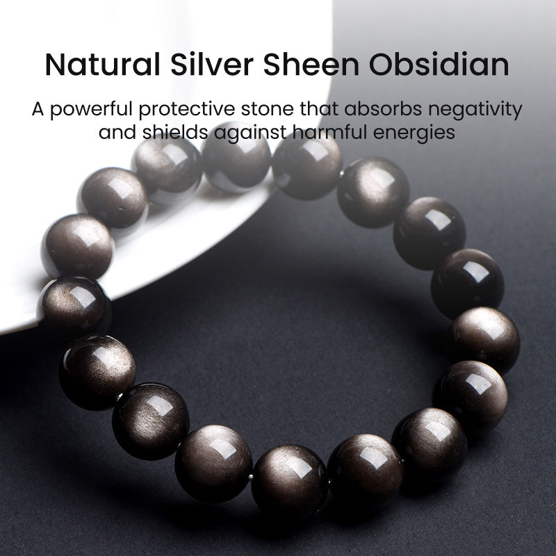 A silver sheen obsidian bracelet on a white plate with descriptive text, showing its grounding and protective properties.