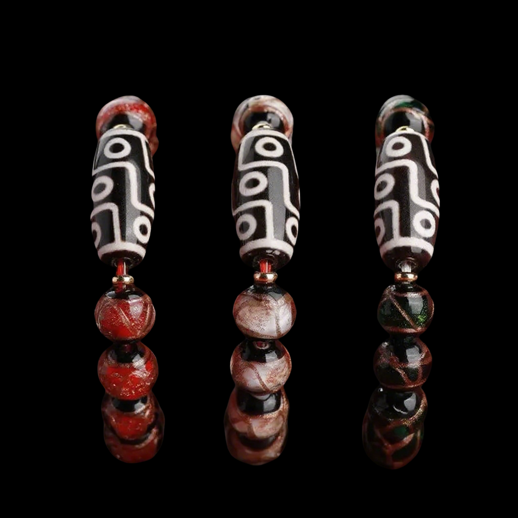 Three vertically arranged Tibetan-style 9-eye Dzi bead bracelet samples, each with distinct color schemes: red, beige-gray, and forest green. These options highlight the customization potential and artistic diversity in spiritual jewelry, with all beads carefully strung and photographed over a high-contrast black background.