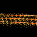 Symmetrical arrangement of three strands of high-gloss yellow crystal beads on reflective surface
