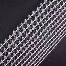 High-grade crystal bead strands in neat rows, reflecting subtle light patterns.
