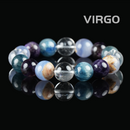 Flat lay of Virgo zodiac bracelet with amethyst, blue kyanite, clear quartz, and light chalcedony gemstone beads, displayed on black reflective background.