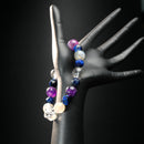 Aquarius astrology bracelet worn on mannequin hand, made with amethyst, labradorite, and quartz beads for balance and intuition.