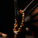 Citrine bracelet displayed on a mannequin hand in warm lighting, evoking an aura of sunshine, abundance, and positivity.