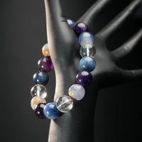 Virgo astrology bracelet worn on black mannequin hand, featuring a mix of purple amethyst, blue kyanite, and white chalcedony for mental clarity.