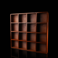 This image shows a large square wooden organizer box with 16 equally sized compartments. The box is positioned upright against a black background, highlighting the warm wood grain and symmetrical grid layout.